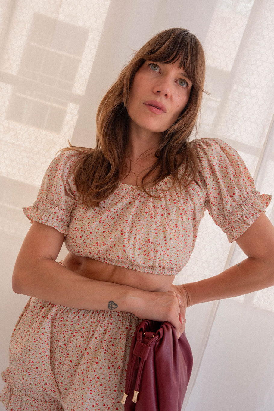 Woman wearing a floral dress with a blurred background